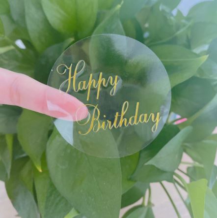 AT007 - Folha com 6  Autocolantes  Transparente Happy Birthday 6 cm